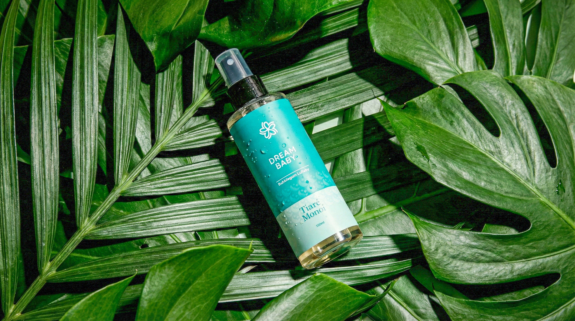 Bottle of dream baby oil on a leafy background